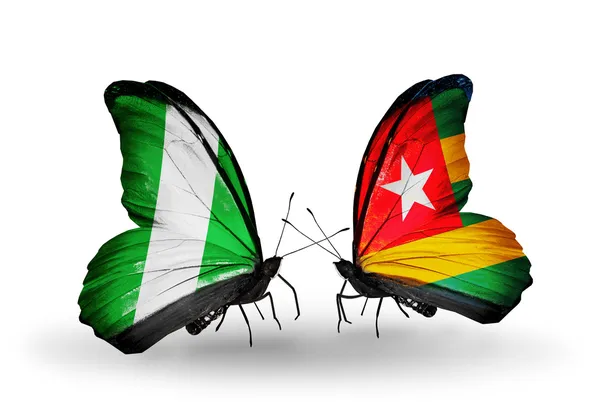 Motyle z Nigerii i togo flagi na skrzydłach — Zdjęcie stockowe