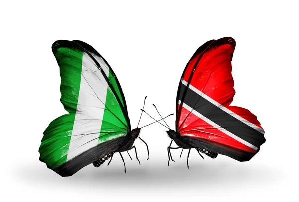 Motyle z Nigerii i Trynidadu i tobago flagi na skrzydłach — Zdjęcie stockowe