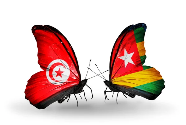 Kelebek kanatları üzerinde Tunus ve togo bayraklı — Stok fotoğraf