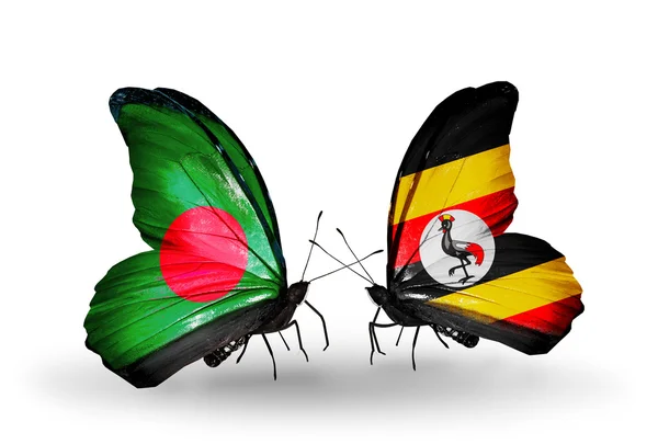 Vlinders met bangladesh en Oeganda vlaggen op vleugels — Stockfoto
