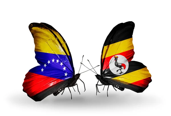 Kelebek kanatları üzerinde venezuela ve uganda bayrağı ile — Stok fotoğraf