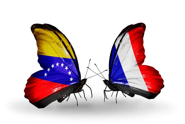 Mariposas con banderas de Venezuela y Francia en alas — Foto de Stock