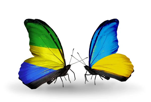 Papillons avec drapeaux Gabon et Ukraine sur les ailes — Photo