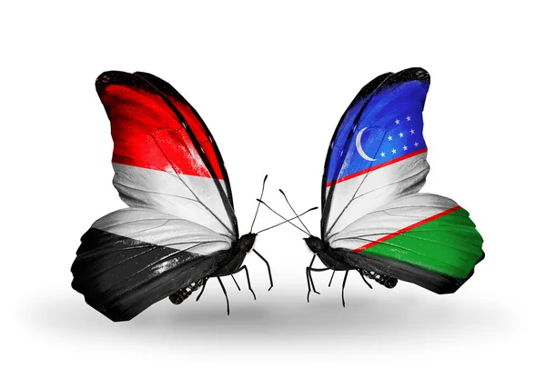 蝴蝶翅膀上的也门和乌兹别克斯坦国旗 — 图库照片