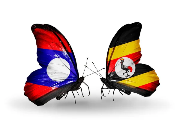 Butterflies with Laos and Uganda flags on wings — Stock Photo, Image