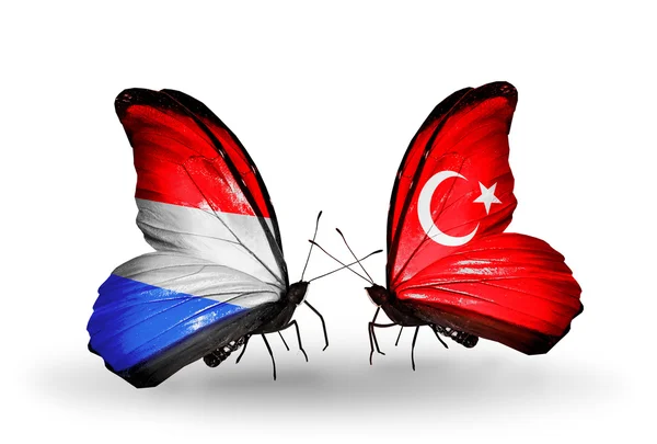 Butterflies with Luxembourg and Turkey flags on wings — Stock Photo, Image