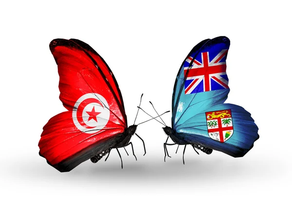Butterflies with Tunisia  and Fiji flags on wings — Stock Photo, Image