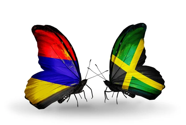 Motýli s Arménií a Jamajka vlajky na křídlech — Stock fotografie