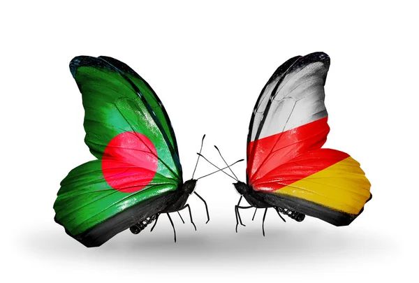 Mariposas con banderas de Bangladesh y Osetia del Sur en alas — Foto de Stock