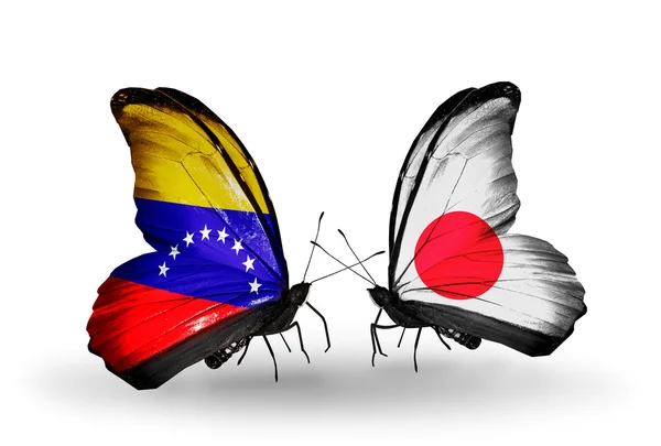 Butterflies with Venezuela and Japan flags on wings — Stock Photo, Image