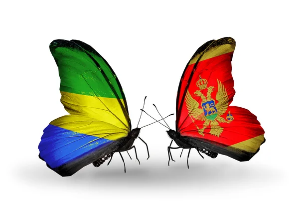 Butterflies with Gabon and Montenegro flags on wings — Stock Photo, Image
