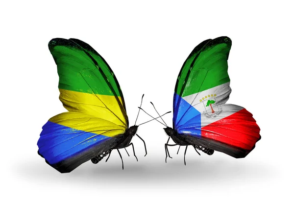 Бабочки с флажками Габона и Экваториальной Гвинеи на крыльях — стоковое фото