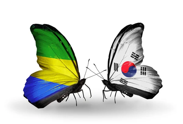 Butterflies with Gabon and South Korea flags on wings — Stock Photo, Image