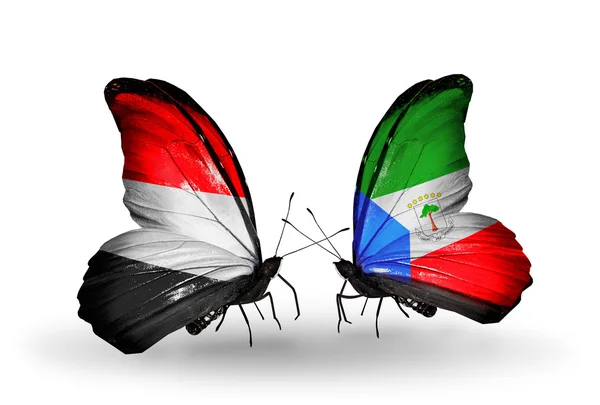 Butterflies with Yemen and Equatorial Guinea flags on wings — Stock Photo, Image