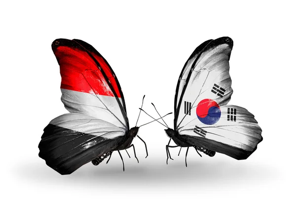 Butterflies with Yemen and South Korea flags on wings — Stock Photo, Image