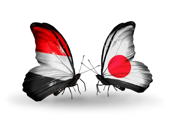 Butterflies with Yemen and Japan flags on wings — Stock Photo, Image