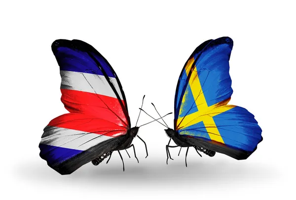 Borboletas com bandeiras da Costa Rica e Suécia em asas — Fotografia de Stock