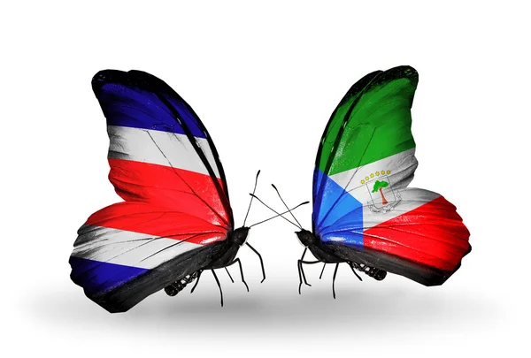 Borboletas com bandeiras da Costa Rica e da Guiné Equatorial em asas — Fotografia de Stock