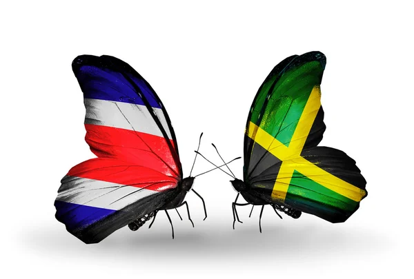 Papillons avec des drapeaux Costa Rica et Jamaïque sur les ailes — Photo