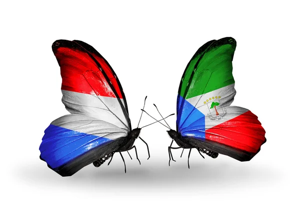 Butterflies with Luxembourg and Equatorial Guinea flags on wings — Stock Photo, Image