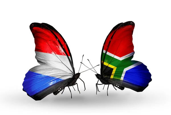 Butterflies with Luxembourg and South Africa flags on wings — Stock Photo, Image