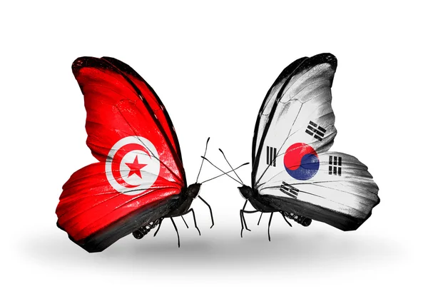 Fjärilar med Tunisien och Sydkorea flaggor på vingar — Stockfoto