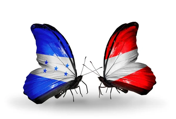 Papillons avec drapeaux Honduras et Autriche sur les ailes — Photo