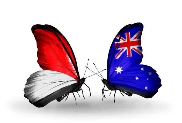 Fjärilar med monaco, Indonesien och Australien flaggor på vingar — Stockfoto