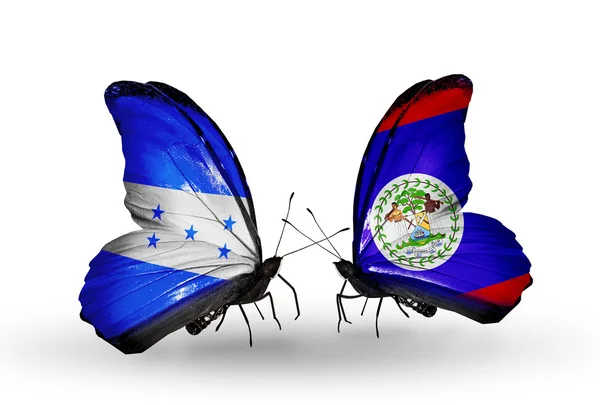 Mariposas con banderas de Honduras y Belice en alas — Foto de Stock