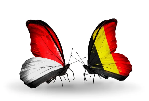 Vlinders met monaco, Indonesië en België vlaggen op vleugels — Stockfoto