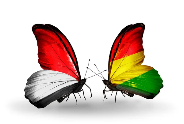 Butterflies with Monaco, Indonesia and Bolivia flags on wings — Stock Photo, Image