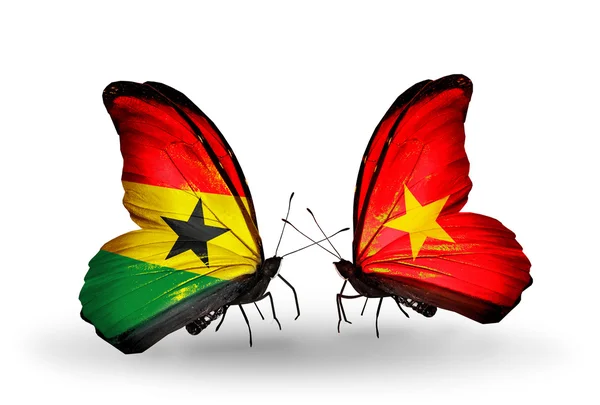 Schmetterlinge mit Ghana- und Vietnam-Flaggen auf Flügeln — Stockfoto