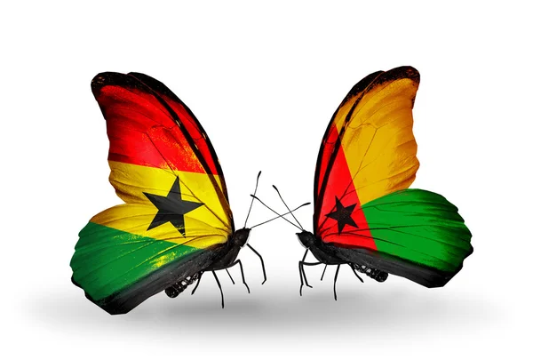 Butterflies with Ghana and Guinea Bissau flags on wings — Stock Photo, Image