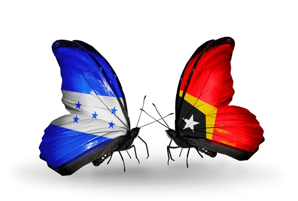 Butterflies with Honduras and East Timor flags on wings — Stock Photo, Image