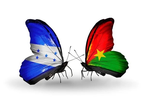 Papillons avec drapeaux Honduras et Burkina Faso sur les ailes — Photo