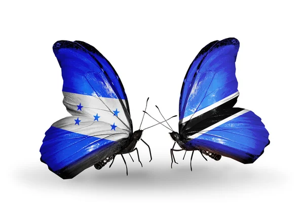 Butterflies with Honduras and Botswana flags on wings — Stock Photo, Image