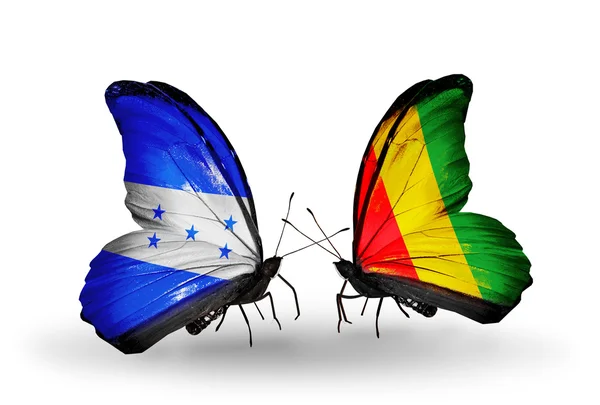 Butterflies with Honduras and Guinea flags on wings — Stock Photo, Image