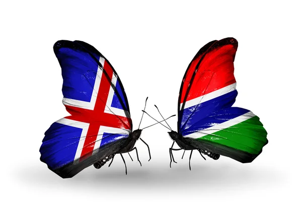 Motýli s Indií a Gambie vlajky na křídlech — Stock fotografie