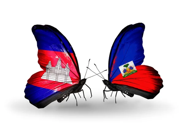 Papillons avec drapeaux Cambodge et Haïti sur les ailes — Photo