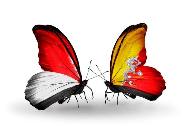 Farfalle con le bandiere di Monaco, Indonesia e Bhutan sulle ali — Foto Stock