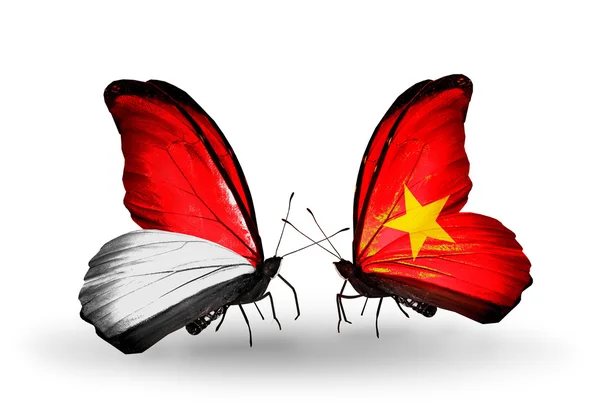 Butterflies with Monaco, Indonesia and Vietnam flags on wings — Stock Photo, Image