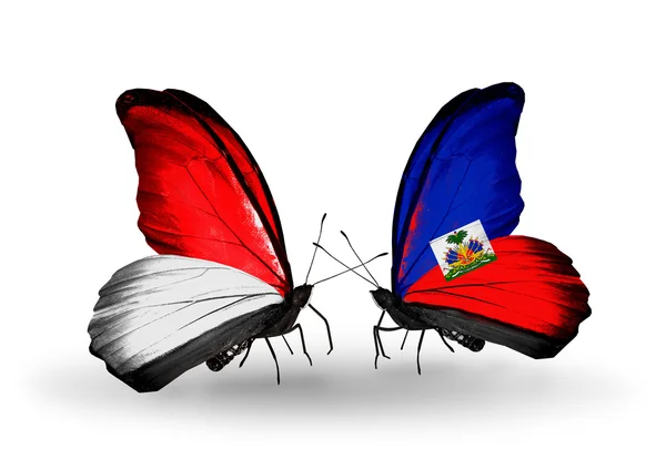 Butterflies with Indonesia and Haiti flags on wings — Stock Photo, Image