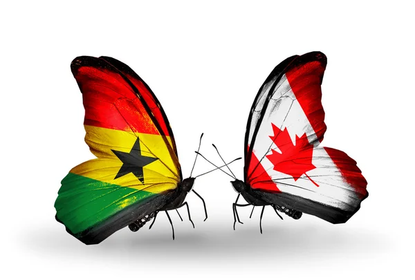 Motyle z Ghany i Kanada flagi na skrzydłach — Zdjęcie stockowe