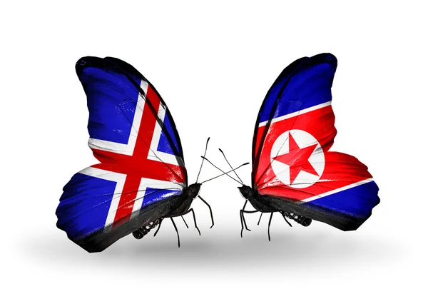 Butterflies with Iceland and  North Korea flags on wings — Stock Photo, Image