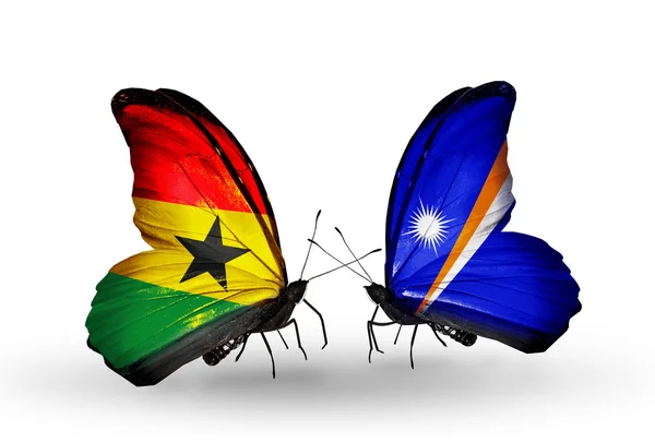 Butterflies with Ghana and Marshall islands flags on wings — Stock Photo, Image