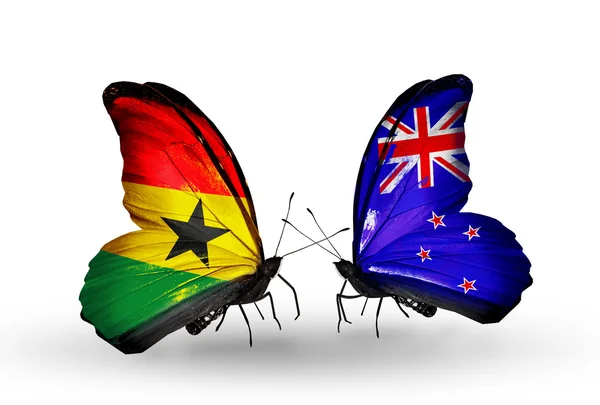 Motyle z Ghany i Nowa Zelandia flagi na skrzydłach — Zdjęcie stockowe