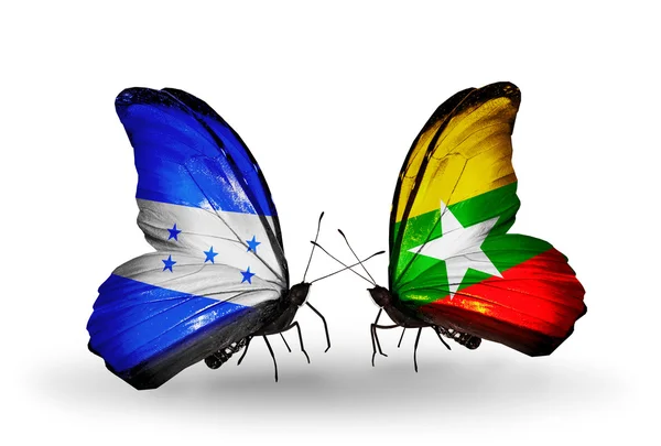 Papillons avec drapeaux Honduras et Myanmar sur les ailes — Photo