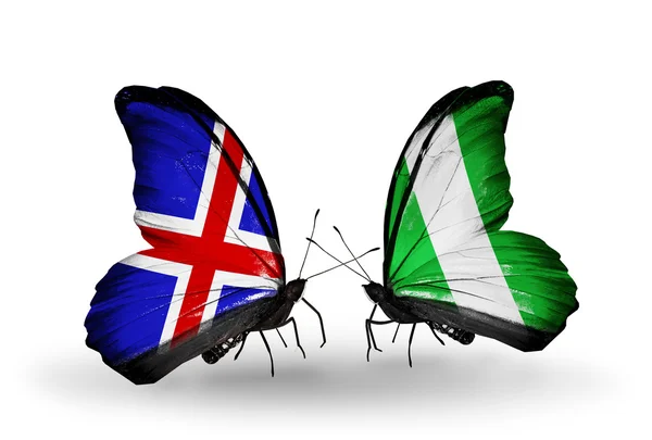 Borboletas com bandeiras Islândia e Nigéria em asas — Fotografia de Stock