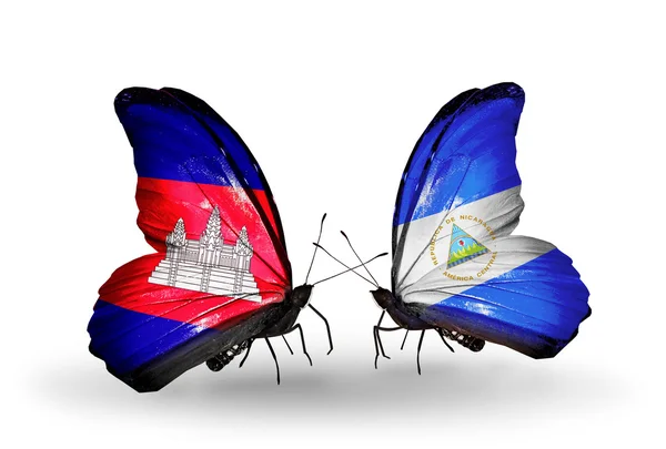 Papillons avec drapeaux Cambodge et Nicaragua sur les ailes — Photo