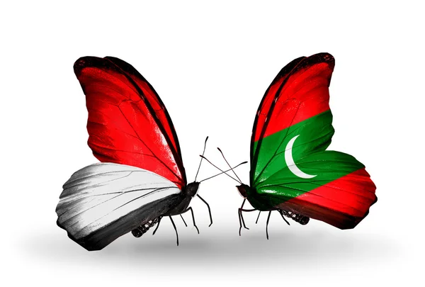 Butterflies with Monaco, Indonesia and Maldives flags on wings — Stock Photo, Image